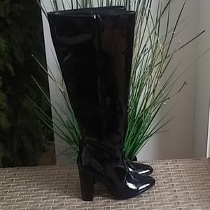 Knee high black patent leather boots